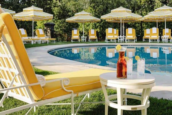 Colorful poolside seating at Commodore Matthew Perry Estate