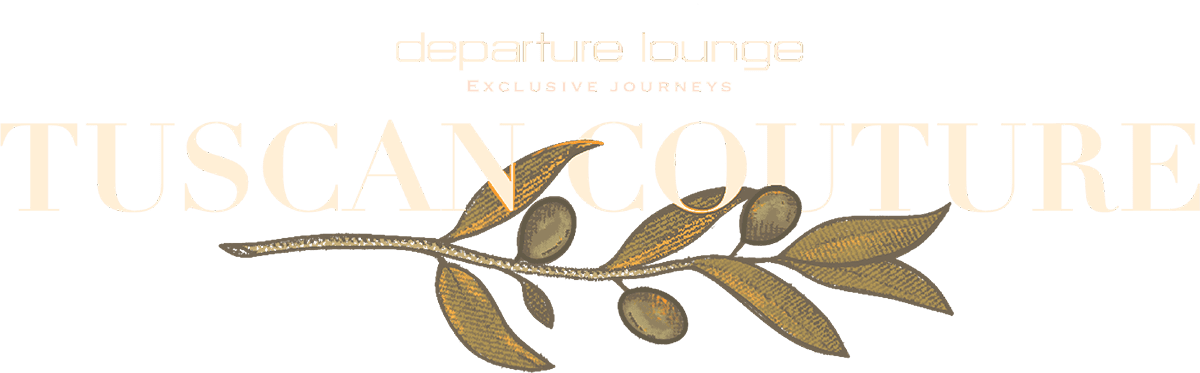 A graphic featuring the text "TUSCAN COUTURE" in large, elegant font, with "departure lounge" and "EXCLUSIVE JOURNEYS" in smaller text above. The background is a warm orange color, and there is an olive branch illustration beneath the main text.