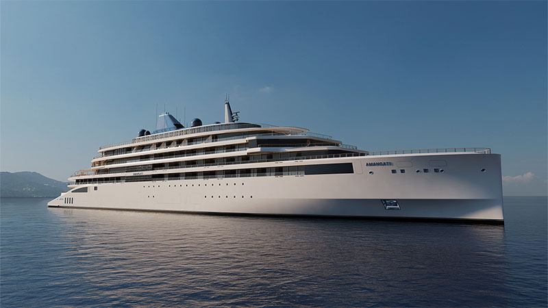Amangati Exterior A large, modern cruise ship named "AMMAGATTE" anchored in calm waters, with a scenic shoreline in the background and clear blue skies above.